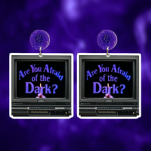 Load image into Gallery viewer, Earrings featuring a retro TV with &#39;Are you afraid of the dark?&#39;  90s Nickelodeon show logo on the screen
