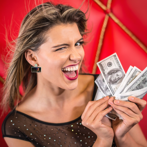 A woman holding up cash wearing earrings featuring Lala Kent’s talking head quote “I’m sucking **** for a lot more than a Range Rover” from Vanderpump Rules.