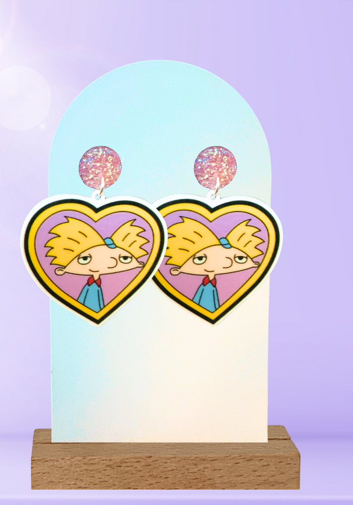 Helga’s Secret Love’ Locket Earrings – Featuring Arnold from Hey Arnold!, these nostalgic earrings capture the essence of young love and cartoon crushes