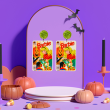 Load image into Gallery viewer, Earrings on a purple stand that feature a vintage Halloween Barbie comic cover from 1993, showing Barbie handing out candy to trick-or-treaters, perfect for fans of Barbie and nostalgic Halloween accessories
