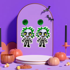 An earring stand featuring earrings of a cute cartoon version of Beetlejuice, perfect for fans of the classic film and nostalgic Halloween fun.