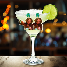 Load image into Gallery viewer, A bar scene with a margarita glass. Earrings featuring Kitty Forman from That 70s show are propped up on the margarita glass, and the earrings feature Kitty pouring a bottle of liquor directly into a blender.
