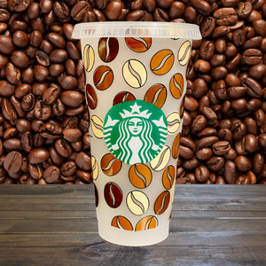 A 16 oz BPA-free Starbucks-compatible reusable cold cup with a coffee bean vinyl wrap. Includes a clear lid and reusable straw, making it ideal for iced coffee lovers, coffee enthusiasts, and affordable gift options like stocking stuffers.