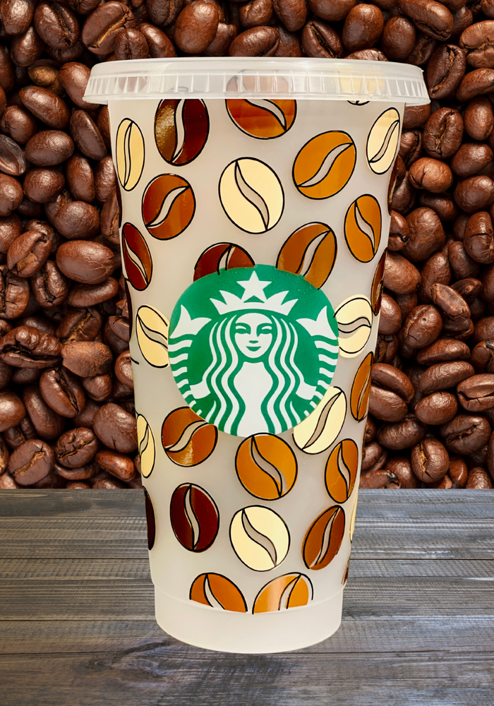 A 16 oz BPA-free Starbucks-compatible reusable cold cup with a coffee bean vinyl wrap. Includes a clear lid and reusable straw, making it ideal for iced coffee lovers, coffee enthusiasts, and affordable gift options like stocking stuffers.