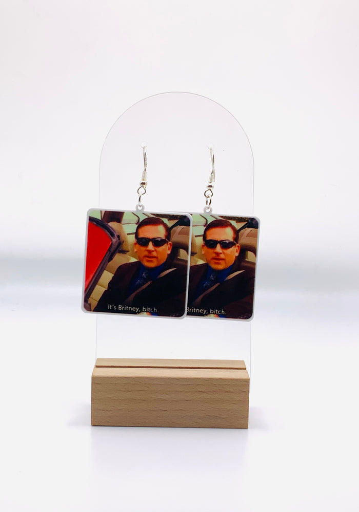Earrings featuring Michael Scott driving in a red car with the caption 