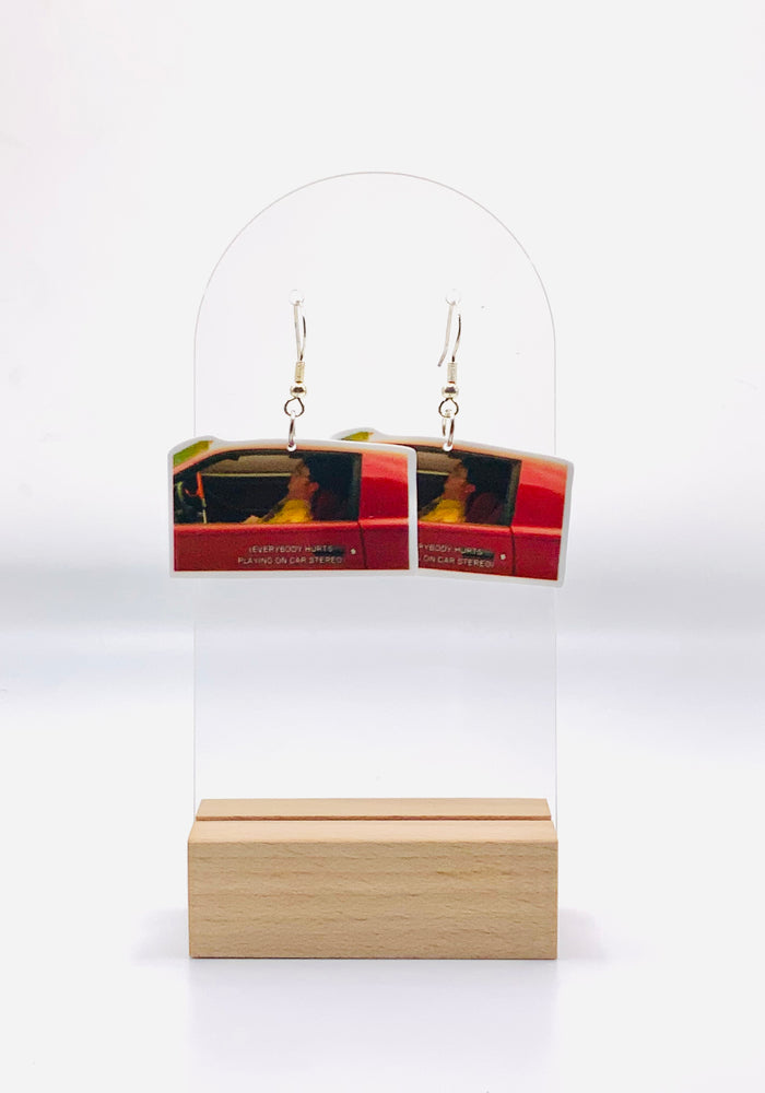 Dwight Schrute in his car listening to 'Everybody Hurts' scene earrings from The Office, capturing a vulnerable yet humorous moment, crafted in high detail