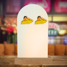 Load image into Gallery viewer, Quirky ‘Ross Geller Unagi’ earrings featuring the iconic Friends character’s gesture for humor and nostalgia featuring a Central Perk background
