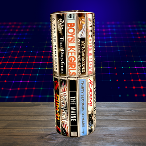 A 20 oz stainless steel insulated tumbler featuring sublimated cassette designs with band names from the Elder Emo era, including Paramore, Fall Out Boy, My Chemical Romance, Blink-182, and The All-American Rejects. Comes with a secure lid and reusable straw, perfect for hot and cold drinks.