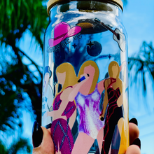 Load image into Gallery viewer, BPA-free 20 oz glass cup featuring Taylor Swift&#39;s iconic eras tour outfits in a vibrant UVDTF wrap design, complete with a bamboo lid and glass straw.
