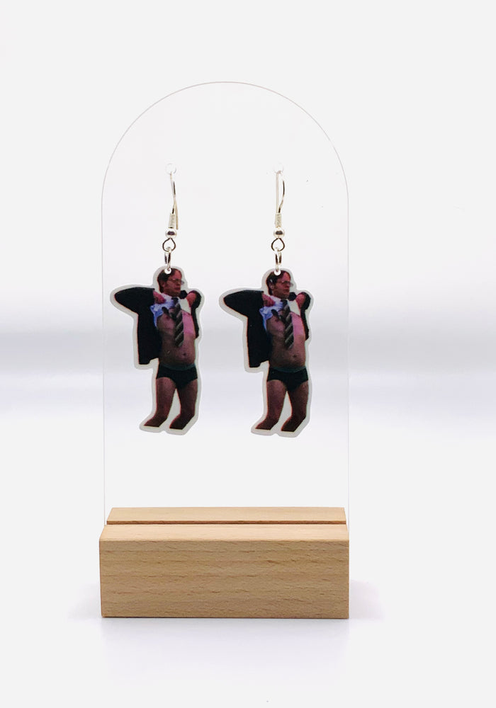 Earrings featuring a detailed print of Dwight Schrute’s surprised face and untucked shirt from “The Office,” capturing the humor of the iconic “No Wire” scene