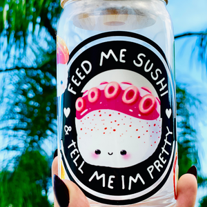 Feed Me Sushi and Tell Me I'm Pretty 16 oz glass cup with bamboo lid and reusable glass straw, featuring a sushi-themed design with colorful rolls, soy sauce, and chopsticks.