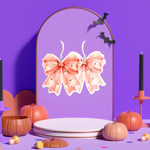 A purple jewelry background featuring pink coquette bow earrings with adorable ghost patterns, perfect for adding a cute and spooky twist to Halloween fashion.