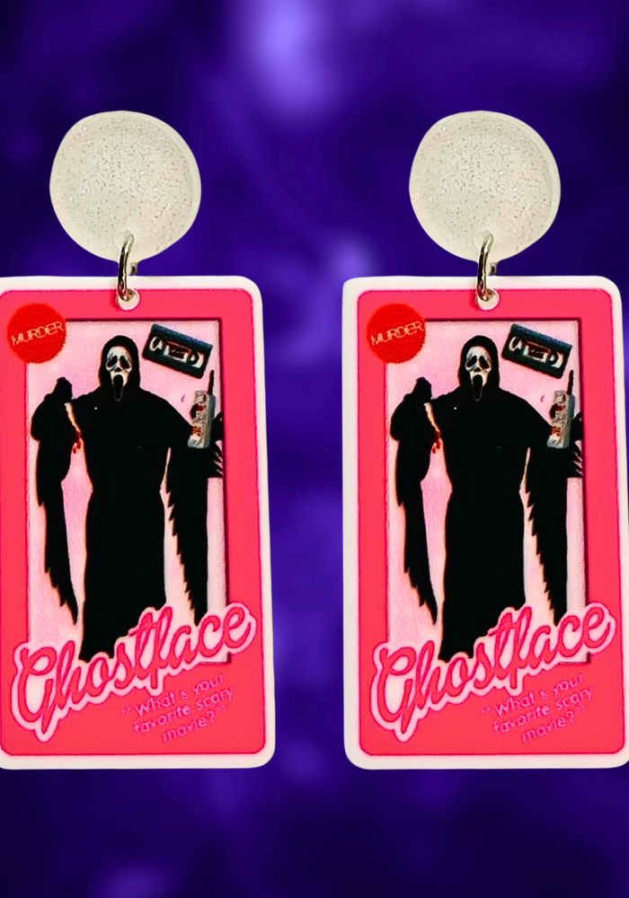 Earrings featuring Ghostface from Scream in a Barbie box, with a phone, knife, and VHS accessories, perfect for horror movie and Barbie fans looking for unique Halloween accessories