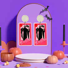 Load image into Gallery viewer, Earrings featuring Ghostface from Scream in a Barbie box, with a phone, knife, and VHS accessories, perfect for horror movie and Barbie fans looking for unique Halloween accessories
