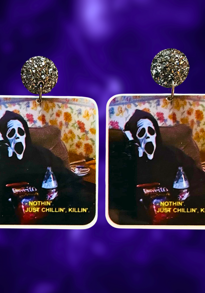 Earrings featuring Ghostface from Scary Movie with the phrase 'Just chilling, killing,' perfect for fans of horror comedies and unique Halloween accessories