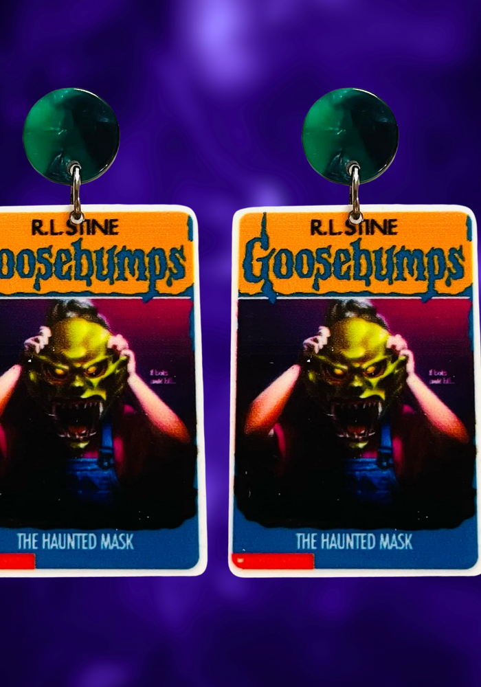 Earrings featuring the Goosebumps 'Haunted Mask' book cover, perfect for fans of the iconic R.L. Stine series and nostalgic Halloween style.