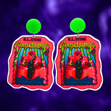 Load image into Gallery viewer, Goosebumps &#39;Living Dummy&#39; book cover earrings on a purple background, perfect for a fun and nostalgic accessory for 90s horror fans
