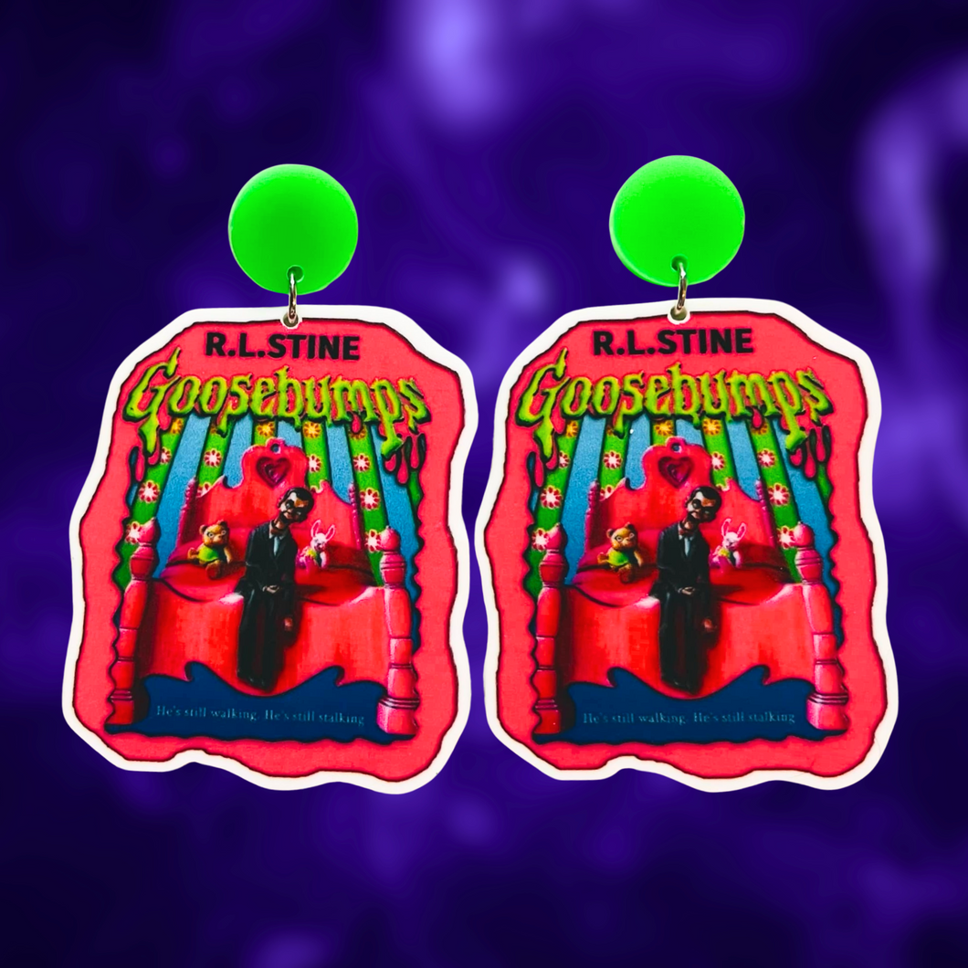 Goosebumps 'Living Dummy' book cover earrings on a purple background, perfect for a fun and nostalgic accessory for 90s horror fans