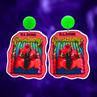 Goosebumps 'Living Dummy' book cover earrings on a purple background, perfect for a fun and nostalgic accessory for 90s horror fans