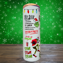 Load image into Gallery viewer, A 20 oz stainless steel insulated tumbler featuring a fun pattern with iconic Grinch quotes. Comes with a clear lid, metal straw, and straw cleaner, perfect for hot and cold drinks. Discounted due to slight ghosting in three small spots.
