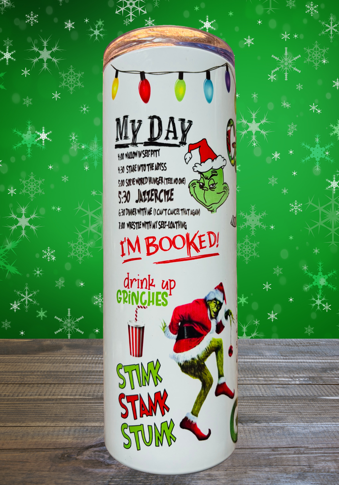 A 20 oz stainless steel insulated tumbler featuring a fun pattern with iconic Grinch quotes. Comes with a clear lid, metal straw, and straw cleaner, perfect for hot and cold drinks. Discounted due to slight ghosting in three small spots.