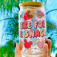 Load image into Gallery viewer, A 16oz BPA-free glass cup featuring a colorful UVDTF wrap with Disney-inspired snacks, including churros, Mickey pretzels, and ice cream. Comes with a bamboo lid and reusable glass straw, perfect for Disney and snack lovers.
