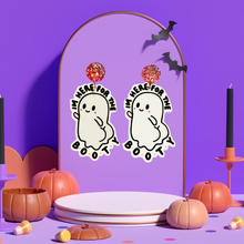 Load image into Gallery viewer, A pair of fun Halloween ghost earrings mounted on a purple backdrop with the text &#39;Here for the BOOty,&#39; designed for adding a playful, quirky touch to Halloween accessories and fashion.
