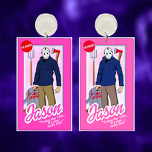 Load image into Gallery viewer, Earrings featuring Jason Voorhees from Friday the 13th in a Barbie box with a pitchfork, axe, machete, and coffin accessories, ideal for fans of horror movies and unique Halloween jewelry
