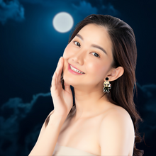 Load image into Gallery viewer, A model in front of a full moon wearing Jason Voorhees earrings
