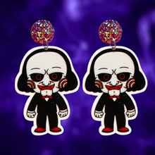 Load image into Gallery viewer, Cute cartoon Jigsaw earrings inspired by the Saw movies, ideal for fans of horror and playful Halloween style.
