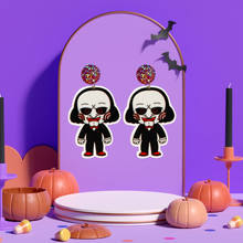 Load image into Gallery viewer, Cute cartoon Jigsaw earrings inspired by the Saw movies, ideal for fans of horror and playful Halloween style.
