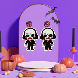 Cute cartoon Jigsaw earrings inspired by the Saw movies, ideal for fans of horror and playful Halloween style.