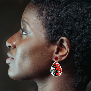 Earrings featuring a cute cartoon version of Jigsaw with the phrase "Do You Want to Play a Game?" from the movie Saw, perfect for horror movie fans and Halloween accessory lovers.