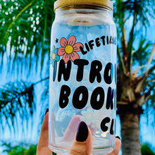 Load image into Gallery viewer, A 20oz BPA-free glass cup with a floral UVDTF wrap featuring the text &quot;Lifetime Member: Introverted Bookworm Club,&quot; paired with a bamboo lid and glass straw. Ideal for bookworms and iced coffee enthusiasts.
