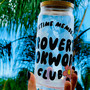 A 20oz BPA-free glass cup with a floral UVDTF wrap featuring the text "Lifetime Member: Introverted Bookworm Club," paired with a bamboo lid and glass straw. Ideal for bookworms and iced coffee enthusiasts.