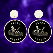 Load image into Gallery viewer, Earrings featuring a skeleton sitting in a coffin giving a thumbs up with the phrase &#39;Never Better,&#39; perfect for edgy Halloween accessories
