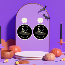 Load image into Gallery viewer, Earrings featuring a skeleton sitting in a coffin giving a thumbs up with the phrase &#39;Never Better,&#39; perfect for edgy Halloween accessories
