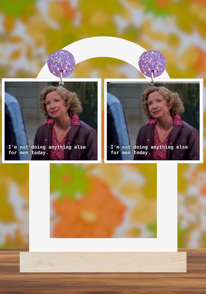 Kitty Forman earrings saying 
