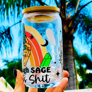 A 16oz BPA-free glass cup with a UVDTF wrap featuring a retro rainbow, celestial accents, and a smudge stick design. Includes a bamboo lid and reusable glass straw, perfect for iced drinks.