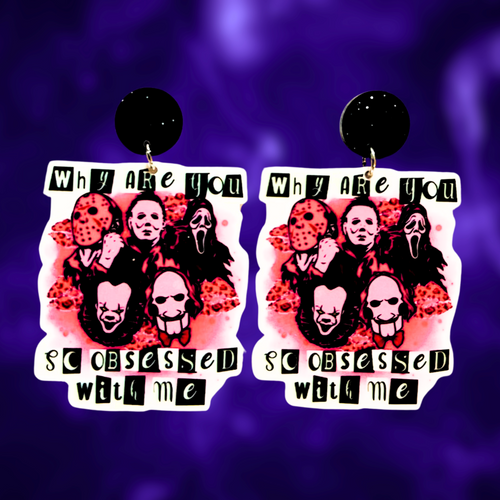 Earrings with the quote 'Why are you so obsessed with me?' featuring horror icons Freddy Krueger, Michael Myers, Ghostface, Pennywise, and Jigsaw, perfect for a fun and bold Halloween look