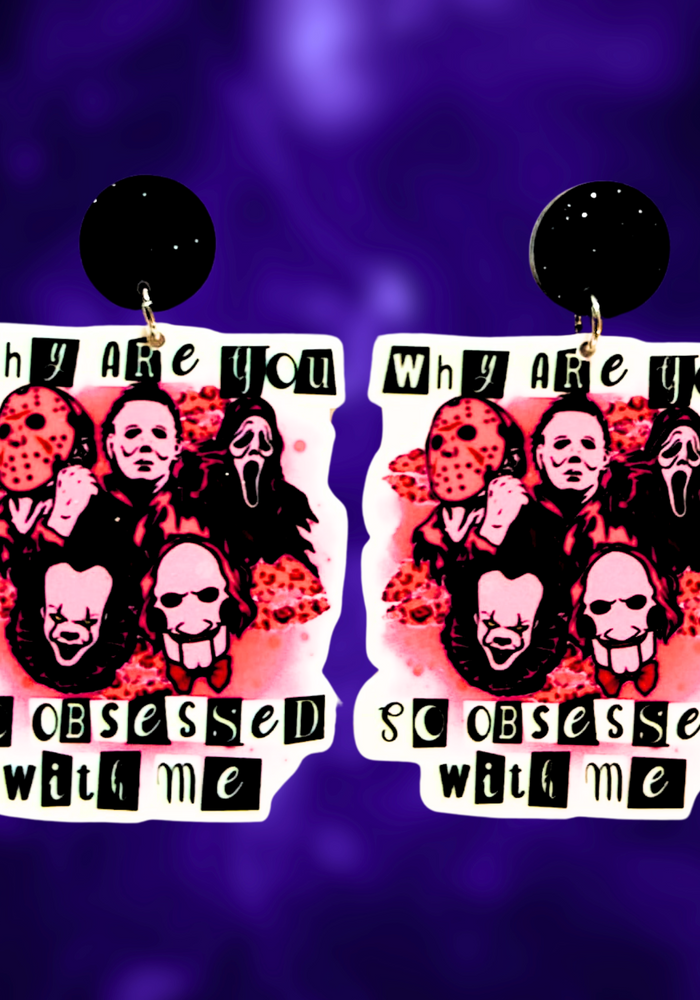 Earrings with the quote 'Why are you so obsessed with me?' featuring horror icons Freddy Krueger, Michael Myers, Ghostface, Pennywise, and Jigsaw, perfect for a fun and bold Halloween look