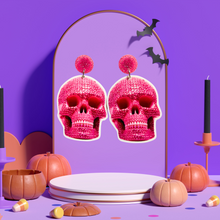 Load image into Gallery viewer, Pink rhinestone skull earrings, perfect for fans of girly and glamorous Halloween accessories.
