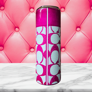 Backside of 20 oz stainless steel insulated tumbler featuring a white and pink leather-inspired background with the signature "C" pattern. 