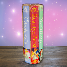 Load image into Gallery viewer, A 20 oz stainless steel insulated tumbler featuring a vibrant design with vintage Disney princess VHS covers, including Cinderella, Beauty and the Beast, and The Little Mermaid. Comes with a clear lid, metal straw, and straw cleaner, perfect for hot and cold drinks.
