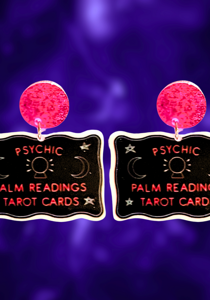 Earrings featuring vintage-inspired psychic reading and tarot card signs, perfect for fans of mystical fashion and Halloween accessories.