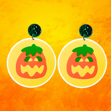 Load image into Gallery viewer, Earrings shaped like Pillsbury Halloween cookies with a pumpkin image on top, perfect for fans of nostalgic fall treats and Halloween accessories
