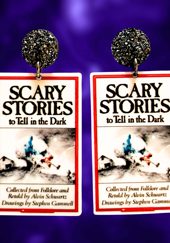 Earrings featuring the Scary Stories to Tell in the Dark book cover, perfect for nostalgic 90s kids and horror fans.