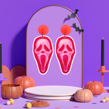 Load image into Gallery viewer, Purple jewelry display with earrings featuring a pop art pink Ghostface mask from the Scream movies
