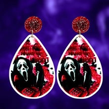 Load image into Gallery viewer, A purple background with earrings featuring Ghostface from Scream on the phone with a bloodstained background and the phrase &#39;No You Hang Up First,&#39; perfect for fans of the cult classic horror movie
