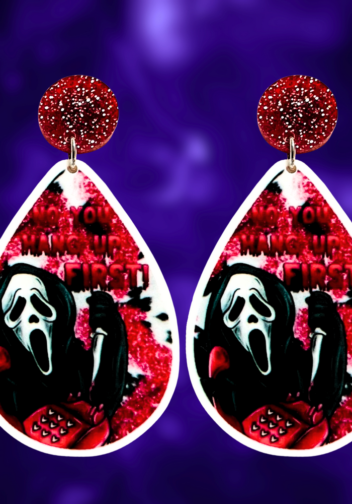 A purple background with earrings featuring Ghostface from Scream on the phone with a bloodstained background and the phrase 'No You Hang Up First,' perfect for fans of the cult classic horror movie